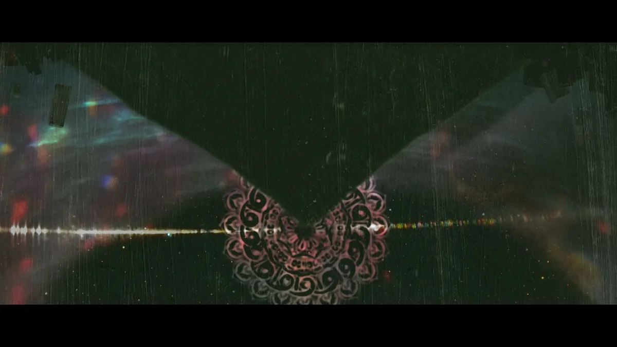 A dark, atmospheric image with rain streaks, glowing light flares, and a central ornate pink and black mandala-like design…