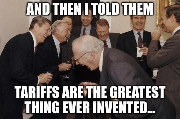 A group of men in suits are gathered around, laughing and holding wine glasses. One older man in the foreground is bent over…