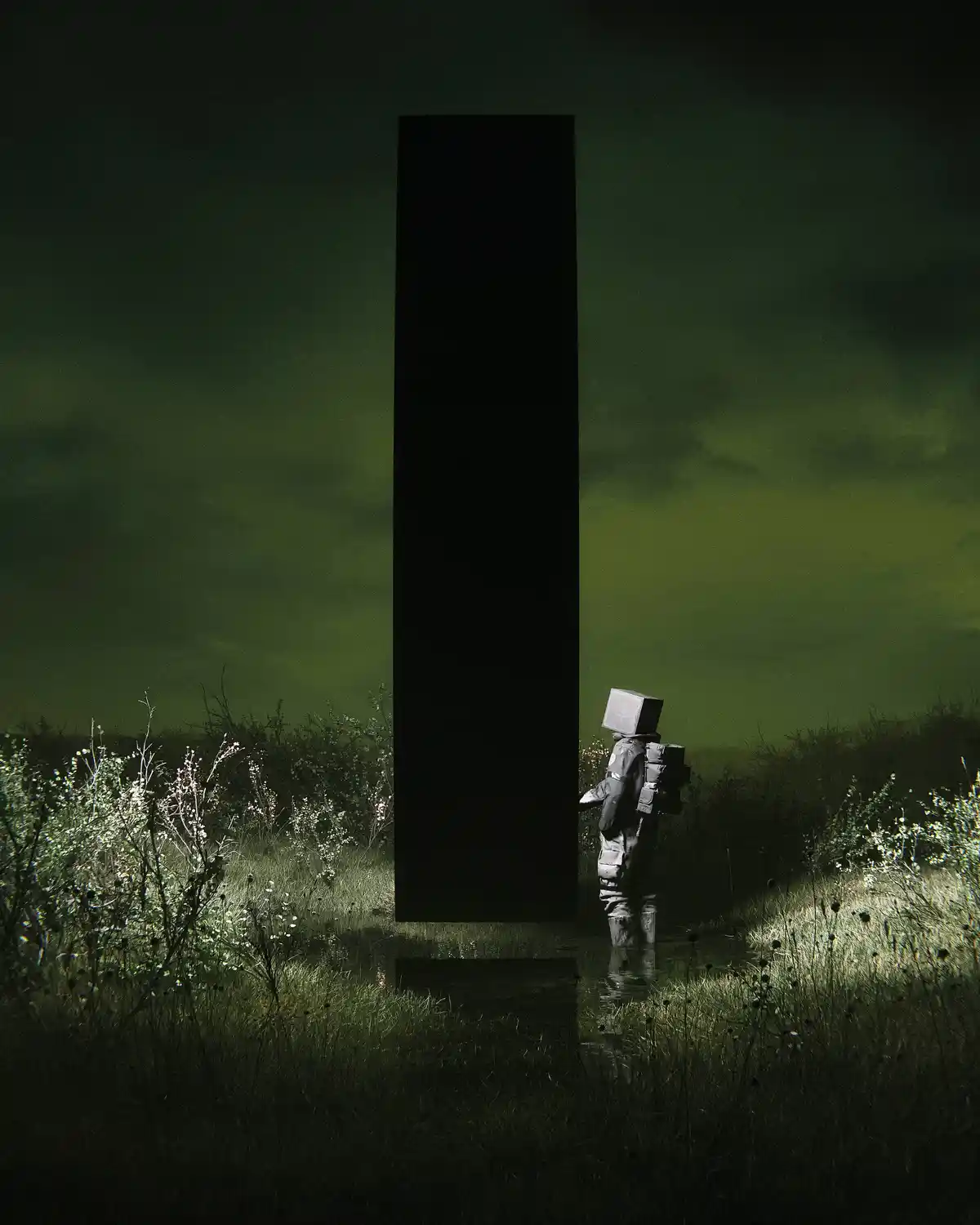 A person in a bulky, sci-fi-style suit with a cube for a head stands in a dark, misty field at night, facing a towering…