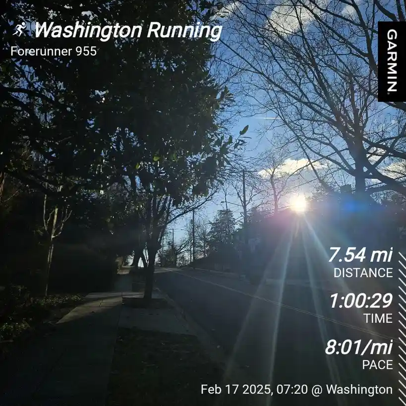 A screenshot from a Garmin Forerunner 955 running watch displays a workout summary over a photo of a sunlit street with…