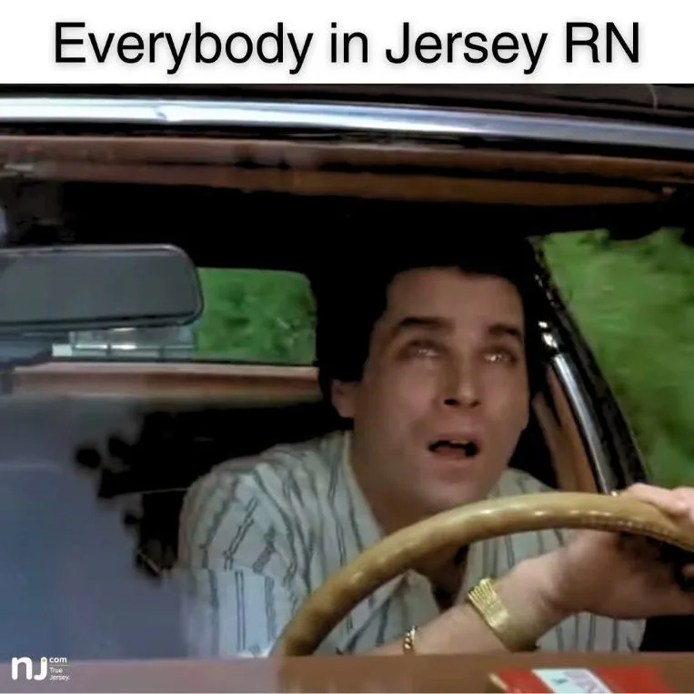 A man with wide, startled eyes is shown driving a car, gripping the steering wheel. The text overlay reads 'Everybody in…
