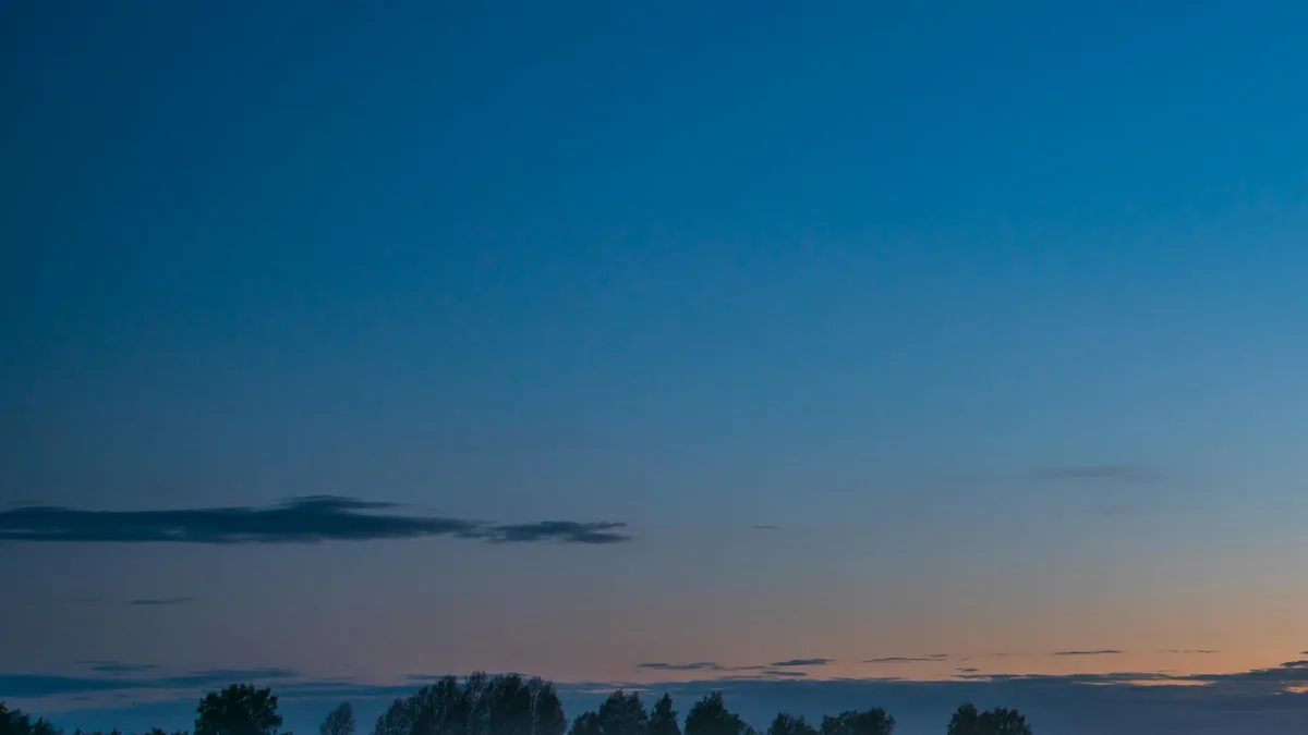 Moonlit twilight casts an ethereal glow on mist-shrouded fields, where nature's beauty is revealed in subtle shades of…